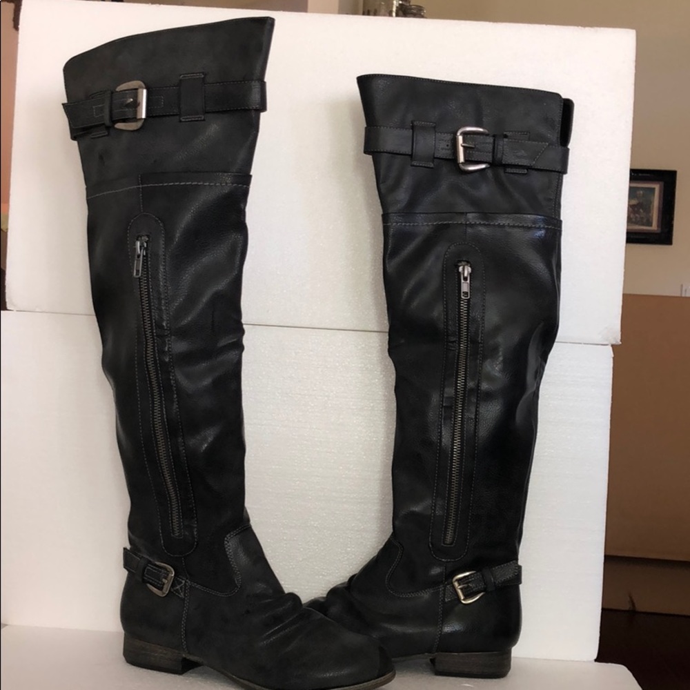 Black leather over the knee boots.